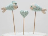 light blue and white crochet fish and a heart cake toppers are very lovely and cute ones for a themed wedding