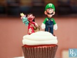 a cupcake with funny game and toon characters is a very cool and fun idea to rock at your wedding