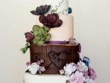a woodland wedding cake in white and chocolate, with sugar flowers and succulents for cake decor