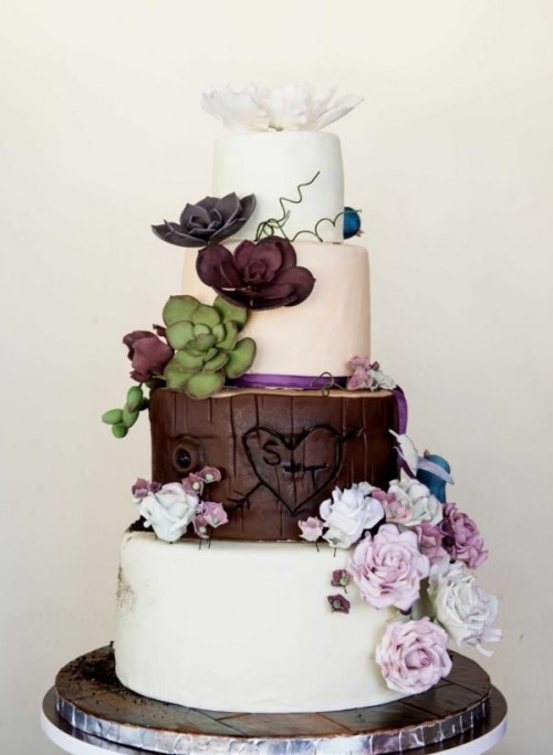 a woodland wedding cake in white and chocolate, with sugar flowers and succulents for cake decor