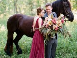 a burgundy thick strap wedding gown with an open back and a V-neckline plus a chic updo