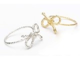 silver and gold rope bow engagement rings are pretty, whimsy and creative, great for a person who loves rustic stuff