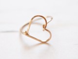 a gold heart-shaped engagement ring is a very romantic and simple solution that is all about love and giivng your heart to somebody