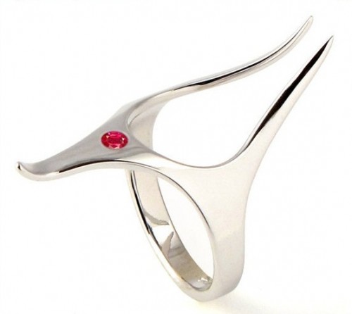 a unique engagement ring with a red rhinestone looks both elvish and space-like, and could be a nice idea for a geeky couple