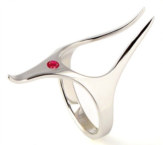 A unique engagement ring with a red rhinestone looks both elvish and space like, and could be a nice idea for a geeky couple