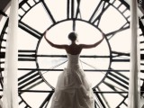 show off your wedding dress in front of a window with a giant clock, it will be a memorable and bold picture