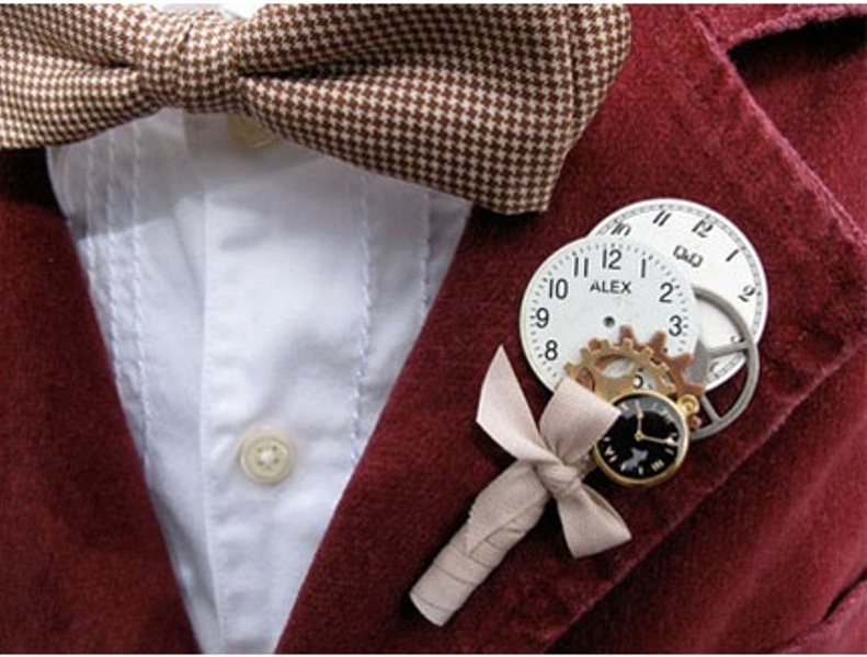 A whimsical wedding boutonniere made of little gears, clocks and a bow is a pretty and quirk y idea for a steampunk groom