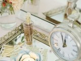 a bride’s tray with a perfume, candles and a vintage table clock is a pretty pic of the bridal morning or you can show off your rings on such a tray