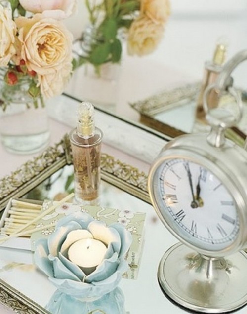 a bride's tray with a perfume, candles and a vintage table clock is a pretty pic of the bridal morning or you can show off your rings on such a tray