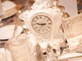 a large vintage white clock used for a wedding centerpiece – a great idea for NYE or vintage wedding
