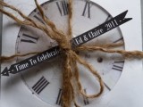 a clock with a tag and twine is a fun and simple wedding favor idea for a NYE wedding