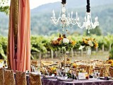 a lovely outdoor wedding reception with cool chandeliers