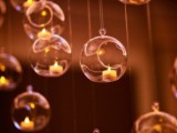 sheer bubble ornaments with mini candles inside can be hung over your cermeony space or reception to add glow to them
