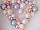 a heart-shaped Christmas wreath fully made of Christmas ornaments wil be a budget-friendly and cute decoration for your wedding
