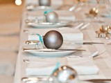 mark each place setting with little ornaments and your reception tables will get a festive feel at once