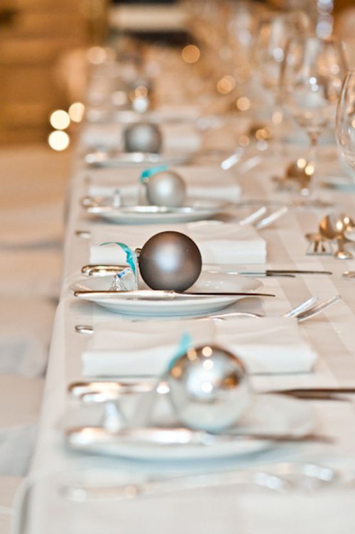 mark each place setting with little ornaments and your reception tables will get a festive feel at once