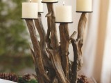 a driftwood candelabra with candles is a nice decoration for a coastal or beach wedding