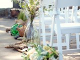 driftwood, greenery, succulents, blooms and branches for lining up the wedding aisle