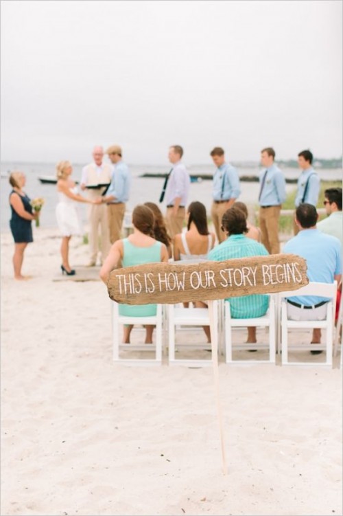 a large wedding sign made of driftwood is a simple and eco-friendly idea for a beach wedding