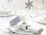 paper snowflakes topping the glasses and accenting the napkin are amazing for a winter wedding in neutrals