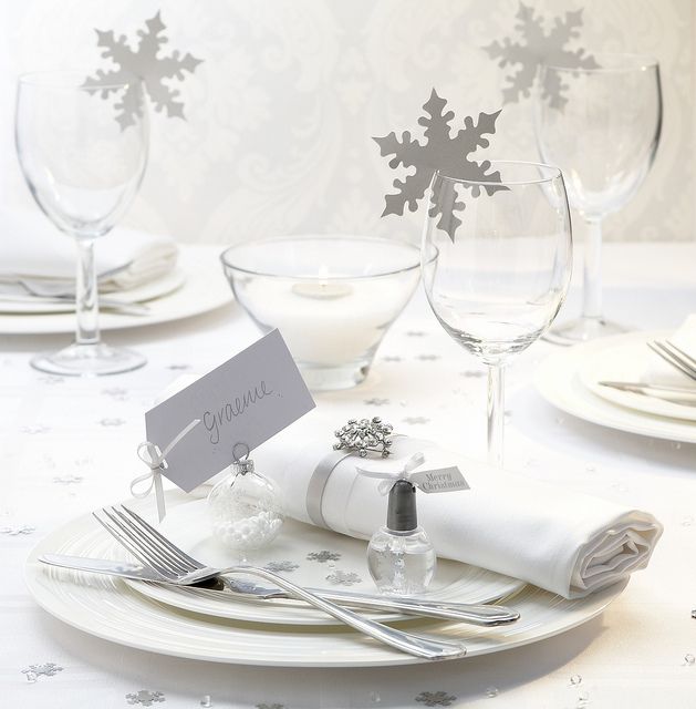 Paper snowflakes topping the glasses and accenting the napkin are amazing for a winter wedding in neutrals