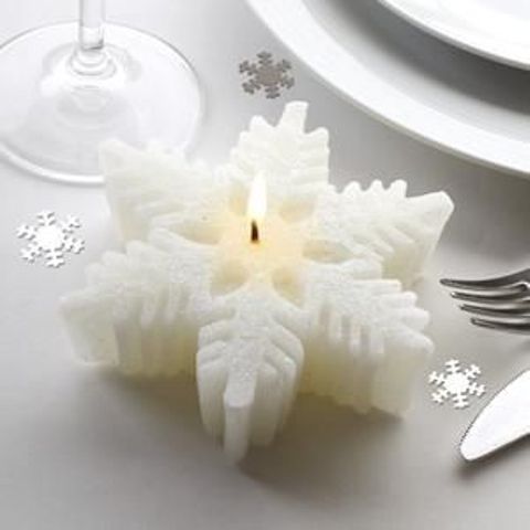 a white snowflake candle is a lovely decor idea or a wedding favor for a winter wedding