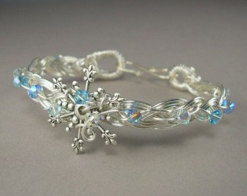 a silver and blue snowflake tiara is a beautiful solution for a winter bride, it will give you a frozen feel