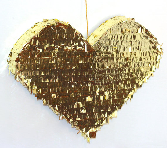 a glam gold fringe heart-shaped pinata wedding guest book is a very fun and creative idea for a glam wedding