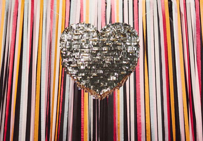 A classic glam silver fringe heart shaped pinata wedding guest book is a very chic and cool idea for a modern glam wedding