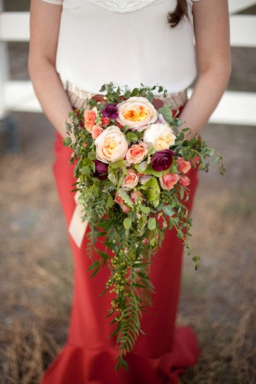 a pretty cascading wedding bouquet of neutral, pink, fuchsia blooms and cascading greenery is a bold and catchy idea for a summer or fall bride