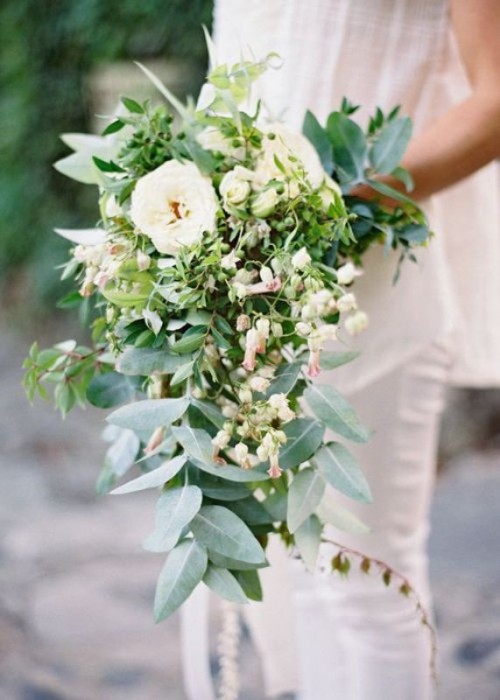 a chic and lush cascading wedding bouquet with neutral blooms, greenery and micro blooms as fillers is a very cool solution for a spring or summer bride