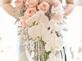 a cascading wedding bouquet of blush roses, white orchids, grasses and greenery is a luxurious idea for a spring or summer bride