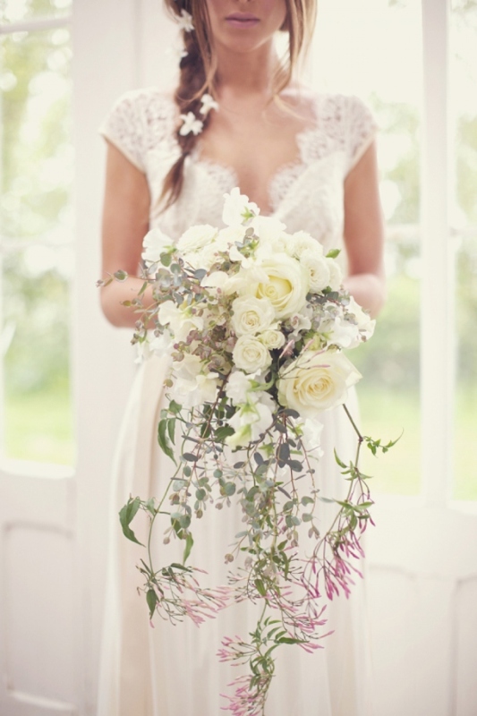 A heavenly airy and chic cascading wedding bouquet with white and pink blooms and greenery is a lovely idea for a spring or summer wedding
