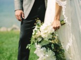 a lush white orchid and greenery cascading wedding bouquet is a refined idea that always works for most of bridal styles