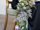 a delicate pastel cascading wedding bouquet with blush and lilac blooms, roses and tulips is a chic idea for spring