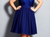 a navy knee dress with a lace bodice, short sleeves and black ankle strap shoes