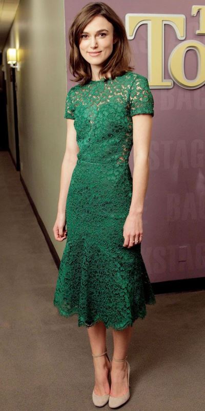 an apple green lace fitting dress with short sleeves and neutral shoes with ankle straps