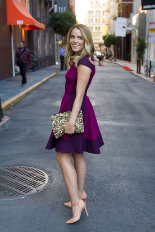 a fuchsia and purple over the knee dress, nude shoes and an embellished clutch