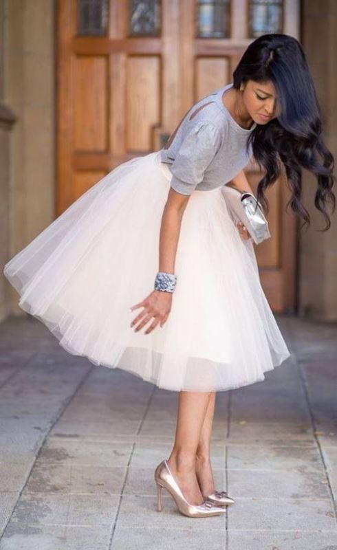 a cute look with a grey top with a cutout back, a tutu skirt, a metallic clutch and metallic shoes