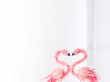 pink flamingo toppers with lots of feathers are amazing as wedding cake or cupcake decor and you can spruce up a simple dessert with them