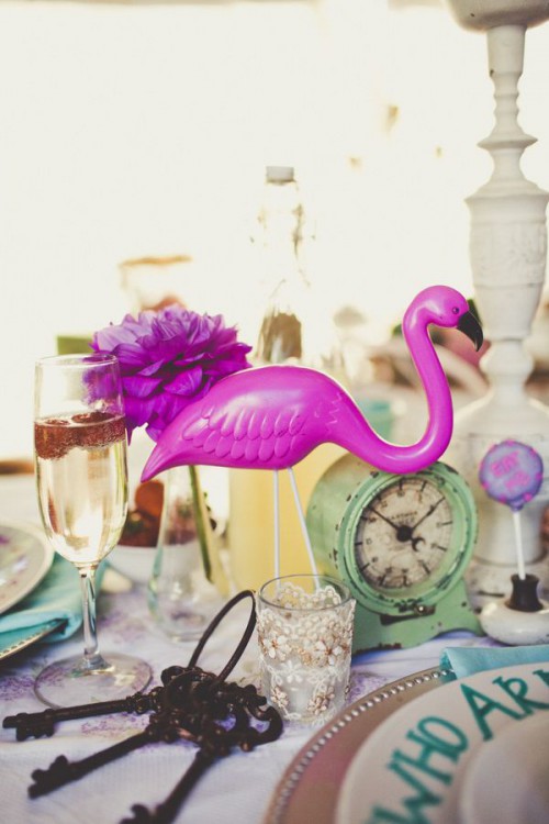 decorate your wedding tables with hot pink blooms and flamingos and make them look bold, fun and very cool