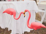 coral pink flamingos that echo with blooms and petals will give a bright touch of color to your space