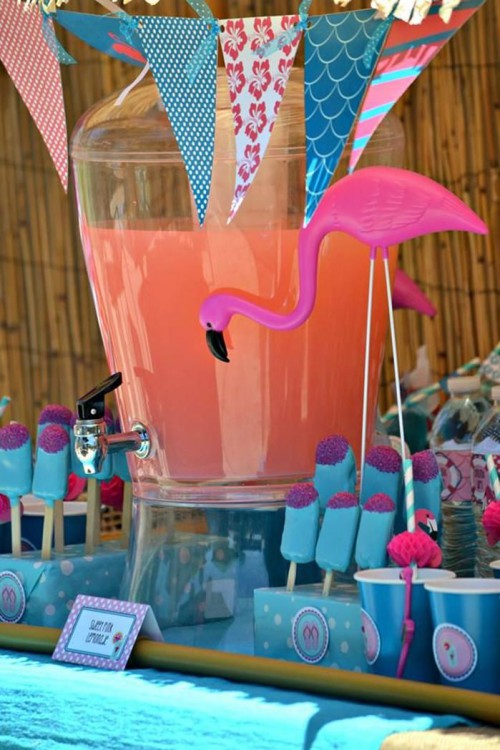 hot pink flamingos dotting your drink and dessert tables will add a bright touch of fun to the space