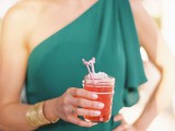 a cool cocktail in a jar topped with a couple of flamingos is a nice idea for a mid-century modern, tropical or just summer wedding