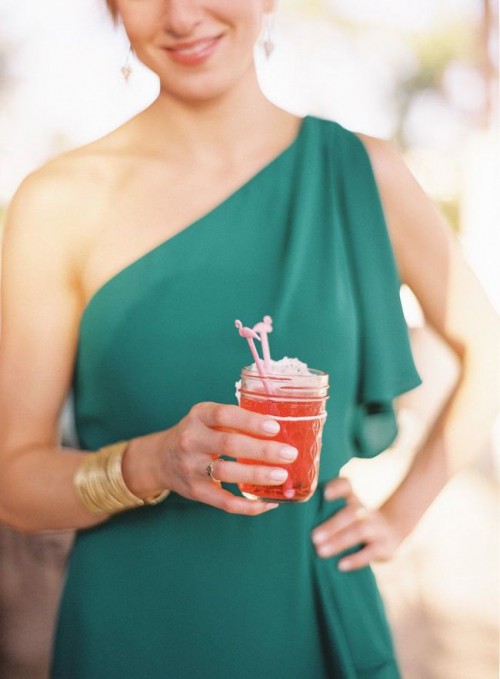 a cool cocktail in a jar topped with a couple of flamingos is a nice idea for a mid-century modern, tropical or just summer wedding