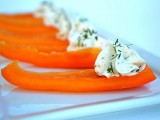 a vegan winter wedding appetizer of pepper slices and cream cheese with herbs will please carnivores too