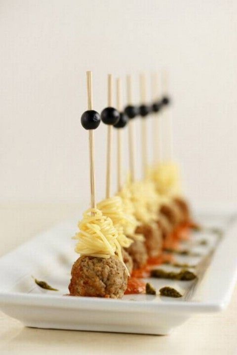 meatballs, spaghetti and olives on skewers are amazing and budget-friendly winter wedding appetizers