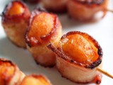 mini bacon wraps on long skewers is a great and hearty appetizer idea for a winter wedding