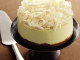 a wedding cheesecake with white chocolate shavings on top is a delicious and cute wedding dessert