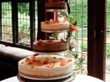 classic and chocolate wedding cheesecakes topped with flower petals and fresh blooms